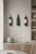 Wieszak-na-wino-Cava-scienny---metalowy-stojak-lewitujacy-na-butelke.webp
